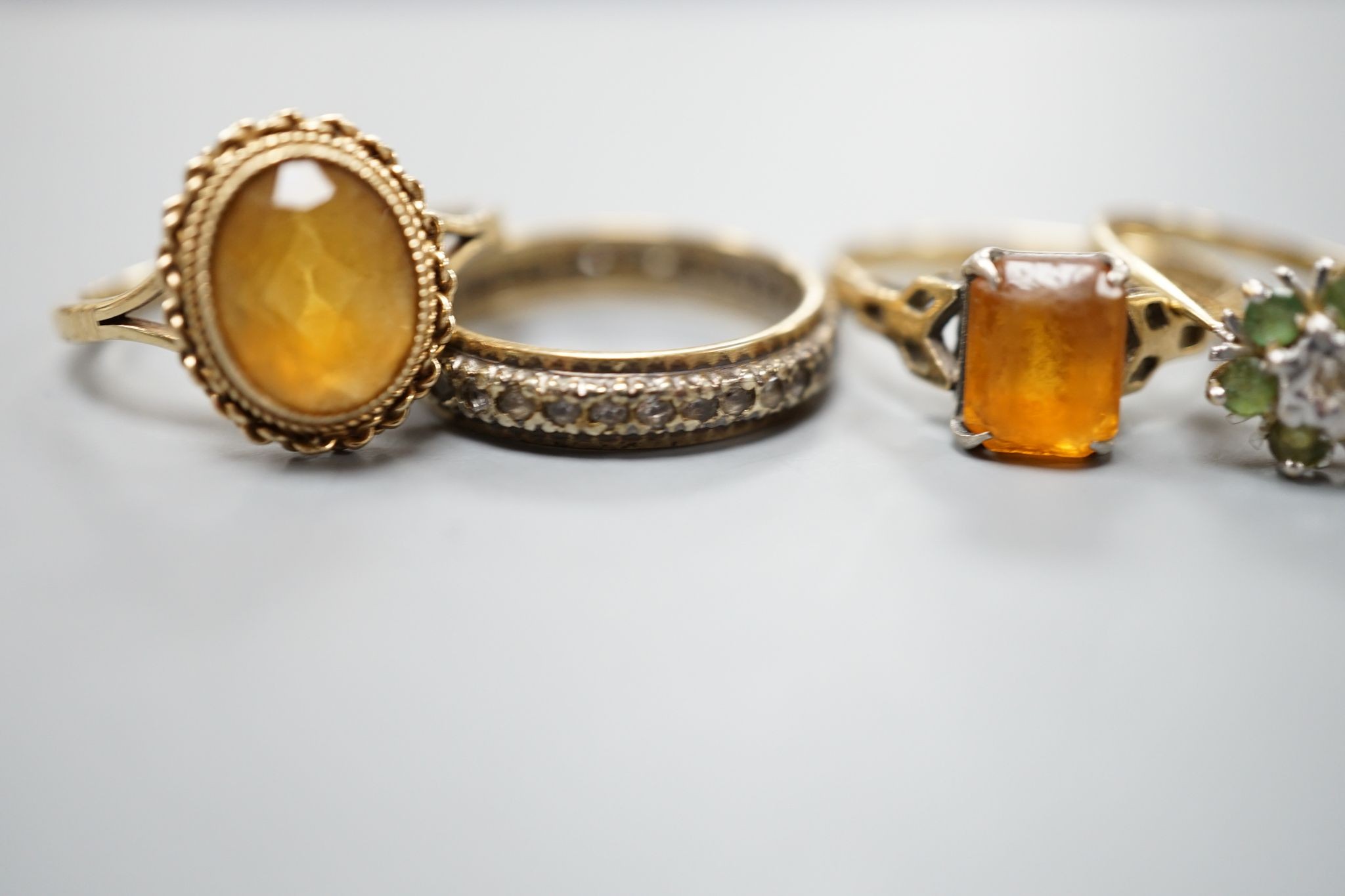 Five assorted 9ct gold and gem set dress rings, including citrine and cultured pearl, gross 12.2 grams.